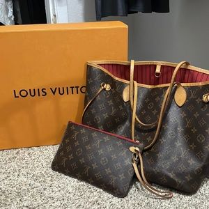 Louis Vuitton purse and small hand purse.